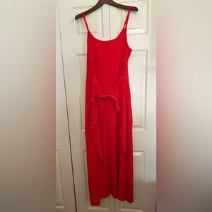 Athleta orange jumpsuit with tie front detail.